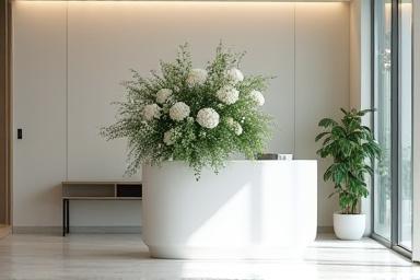 An elegant floral arrangement in a modern corporate reception area.